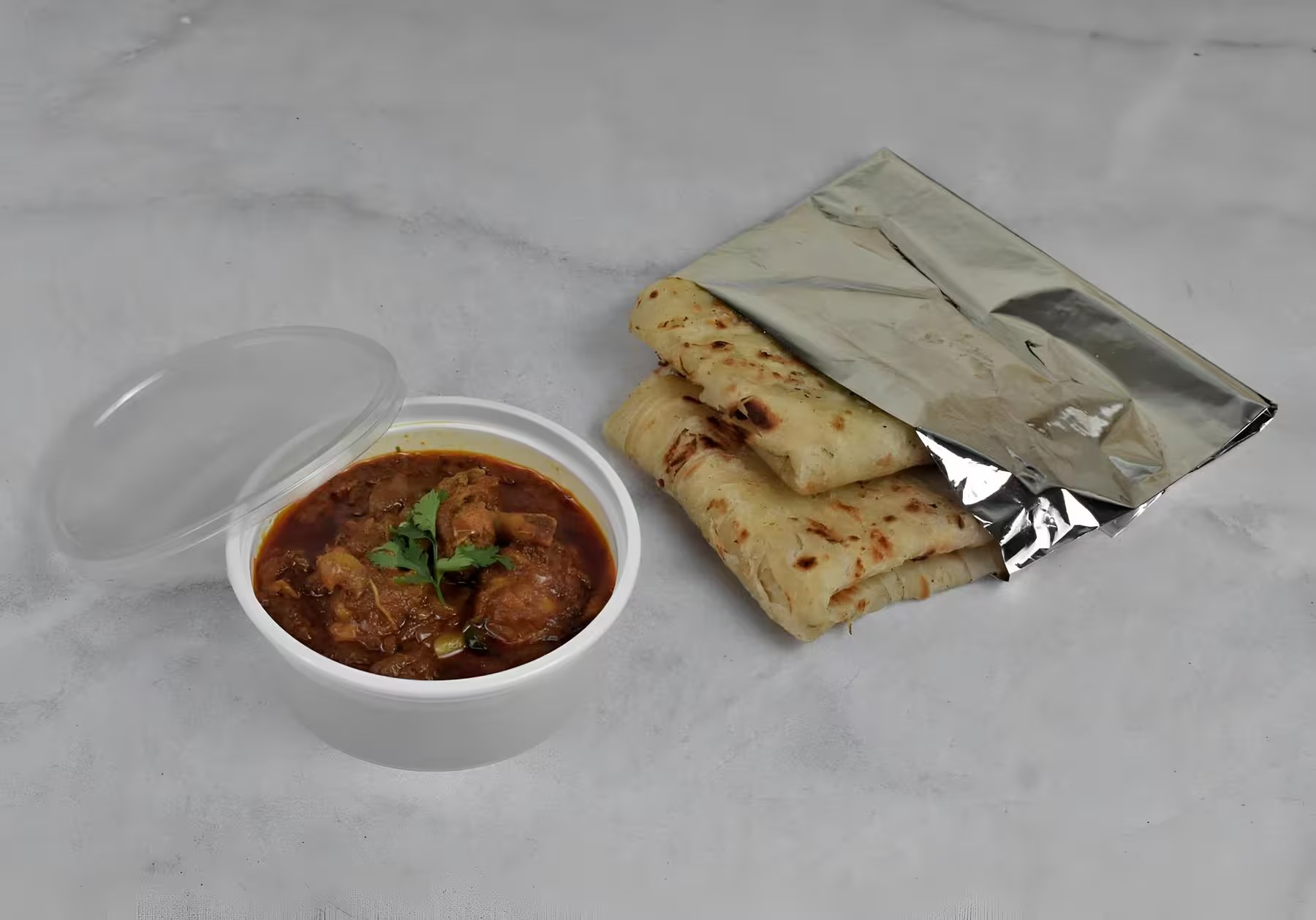Kerala Parotta (2 pcs) + Chicken Masala Combo